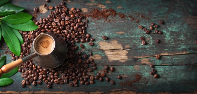 Top view of tasty coffee with coffee beans