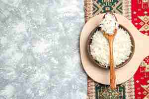 Free photo top view tasty cooked rice inside brown plate on light white