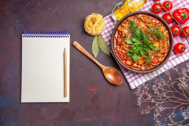 Top view tasty cooked vegetables sauce meal with tomatoes on dark desk meal dinner sauce food dish