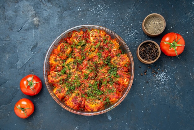 Top view tasty cooked vegetables with ground meat and greens inside pan on blue table dish meal meat cuisine family taste