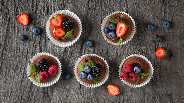 Top view tasty cupcake on wooden background