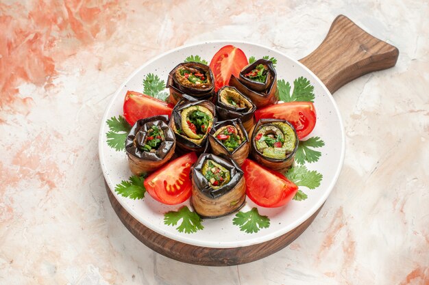 top view tasty eggplant rolls with tomatoes