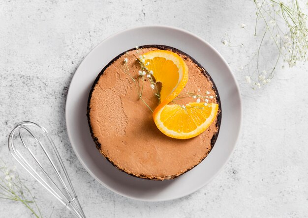 Top view tasty homemade cake with orange slices