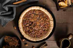 Free photo top view tasty homemade pecan pie on the table