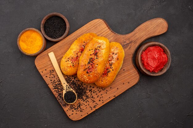 Top view tasty meat patties baked pastries on grey background patty dough pastry bake meal