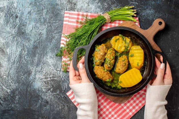 Top view tasty meat rissole with boiled potatoes and greens on gray background color salad food meal dinner