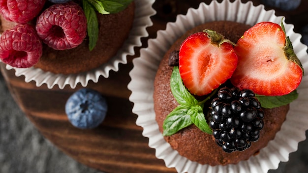 Top view tasty muffin with forest fruit