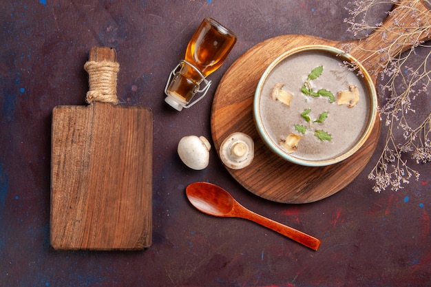 Top view tasty mushroom soup inside plate on dark desk soup vegetables meal dinner food