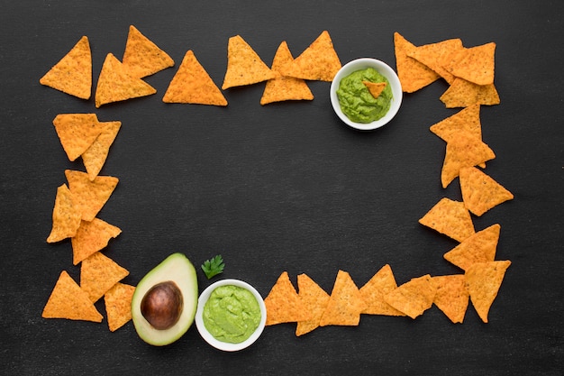 Top view tasty nachos with guacamole on the table