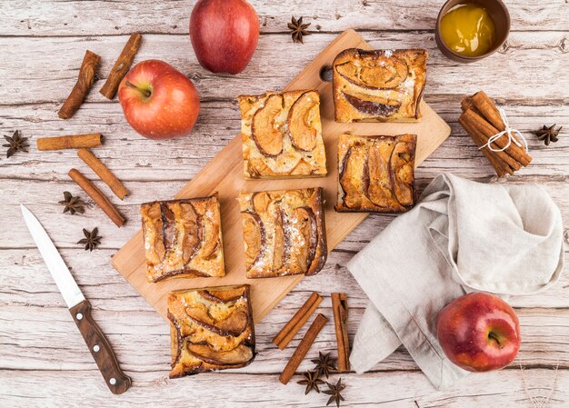 Top view tasty pieces of cake and apples