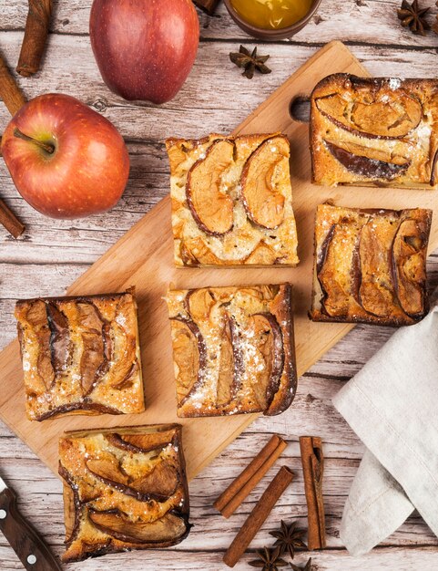 Top view tasty pieces of cake and apples