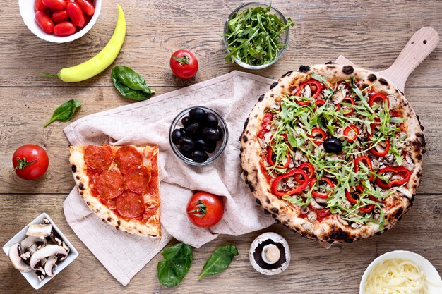 Top view tasty pizza on wooden background