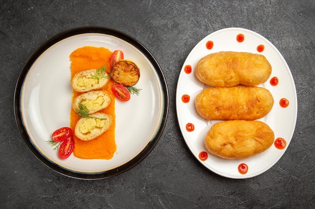 Top view tasty potato pies with hotcakes on grey background bake oven color dish ripe dinner