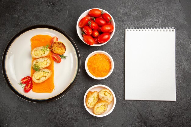 Top view tasty potato pies with pumpkin and fresh tomatoes on grey background dinner oven bake color dish slice