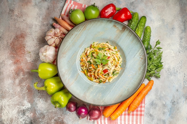 Top view tasty salad with fresh vegetables on light background