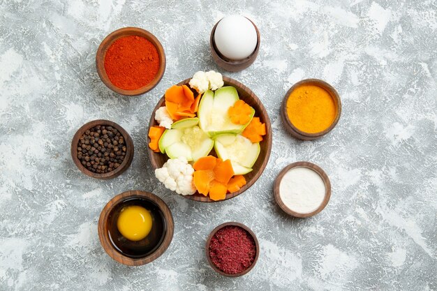 Top view tasty salad with seasonings on white background salad vegetable meal food health