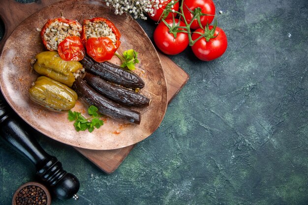 top view tasty vegetable dolma with red tomatoes, meal dinner color cook cuisine food
