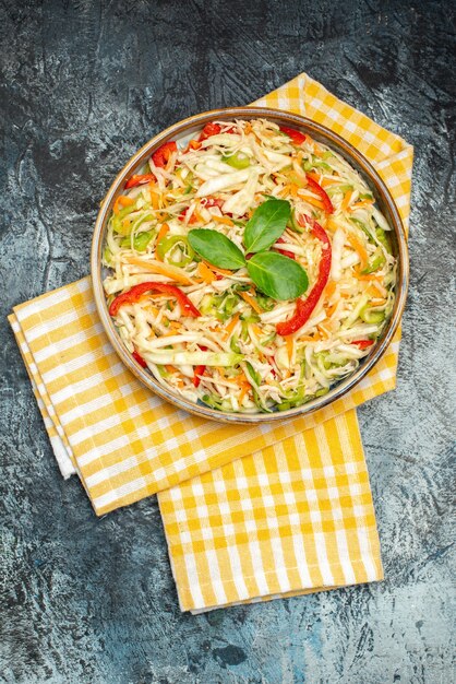 Top view of tasty vegetable salad on dark surface – Free Download