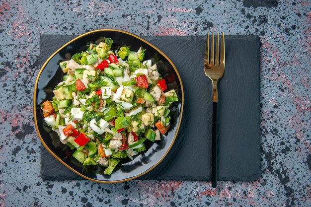 top view tasty vegetable salad with cutlery on dark background food restaurant color lunch diet health ripe