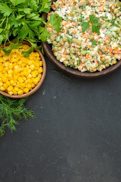 Top view tasty vegetable salad with greens on dark background meal color ripe holiday meat bean salad