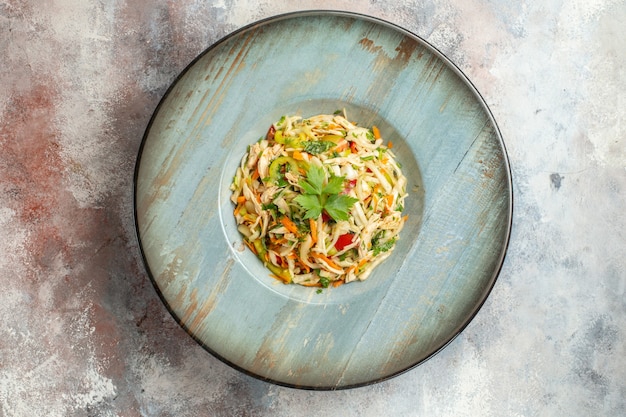 Top view tasty vegetable salad with sliced chicken inside plate on light background