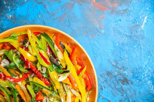 Top view of tasty vegetables on dark surface