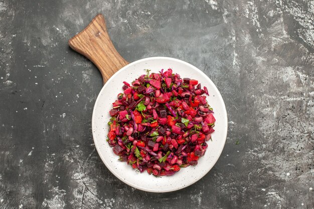 Top view tasty vinaigrette salad with beans and beets on a grey surface