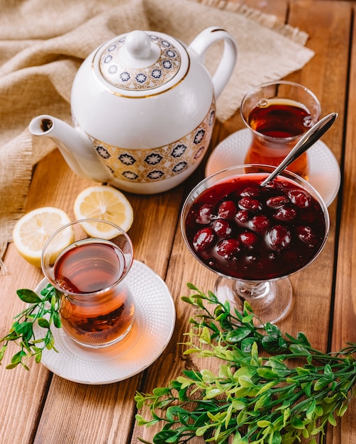 Top view of tea in armudu glass served with azerbaijani murabba and lemon