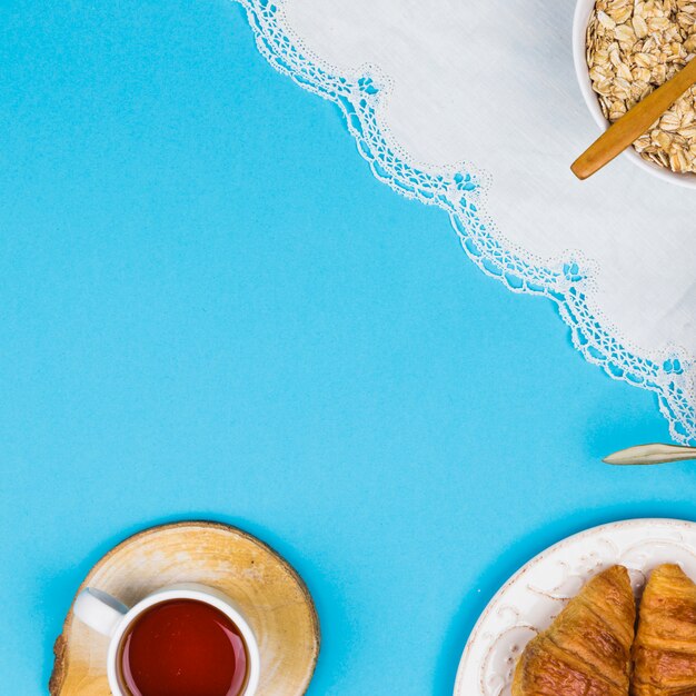 Top view tea cup with breakfast elements