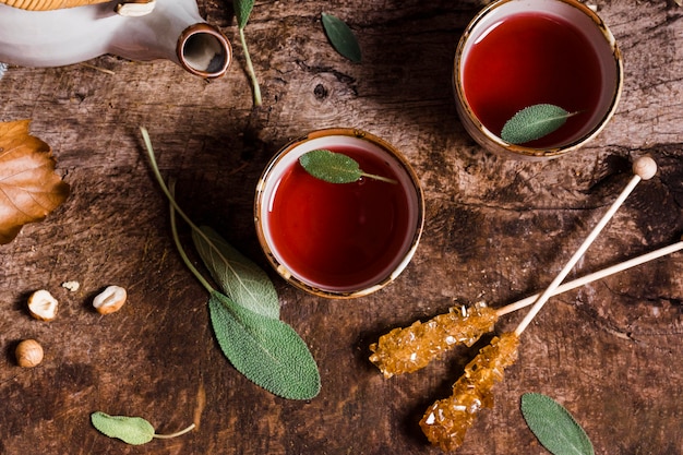 Free photo top view tea in cups with crystallized sugar