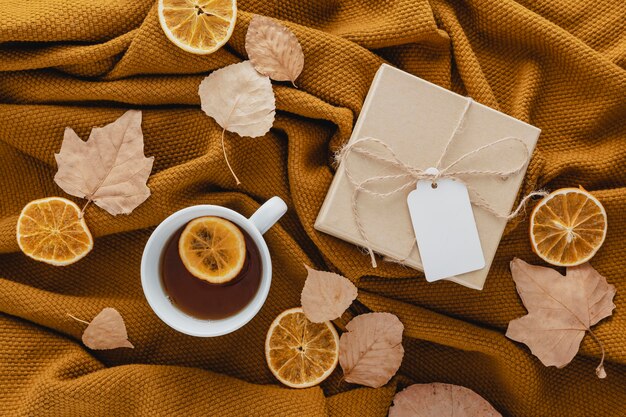 Top view tea and dried lemon slices with gift box