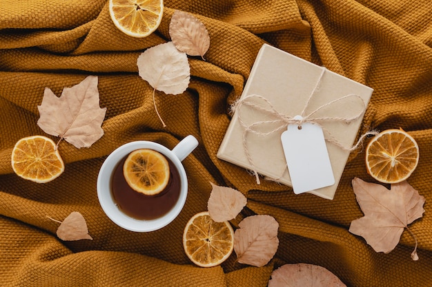 Top view tea and dried lemon slices with gift box