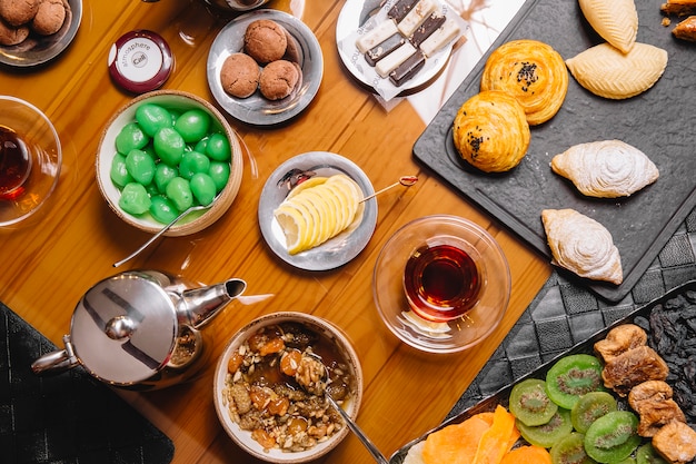 Top view of tea setup with azerbaijani pastry and sweets