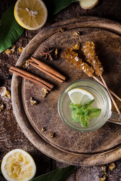 Free photo top view tea with lemon and mint