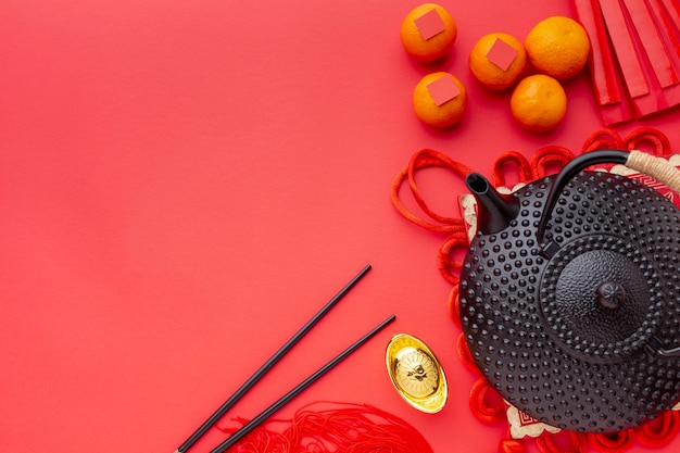 Top view of teapot and chopsticks chinese new year