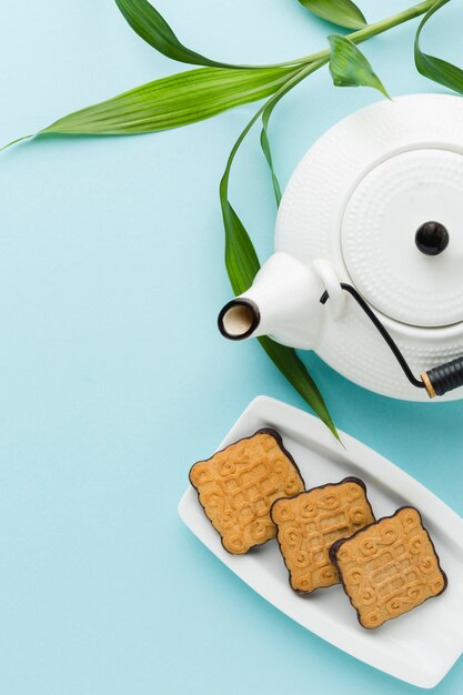 Top view teapot with homemade biscuits