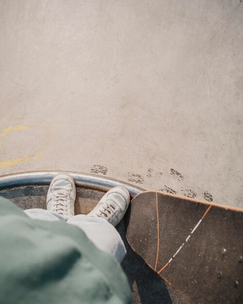 Top view of teenager with skateboard