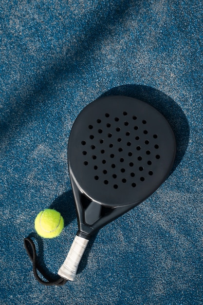 Top view tennis paddle and ball