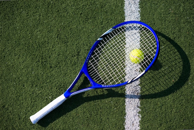 Top view tennis racket on the ball