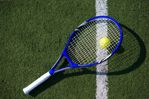 Top view tennis racket on the ball