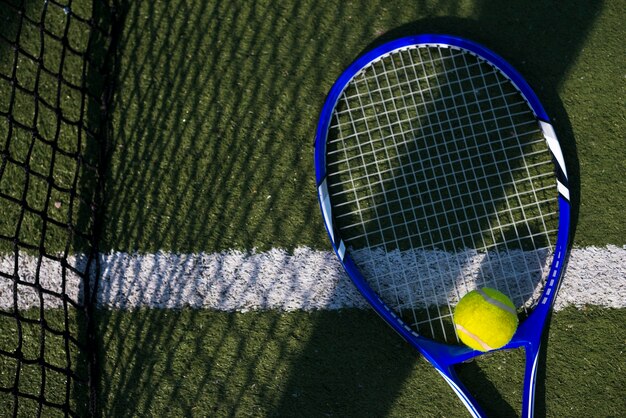 Top view tennis racket with a ball 