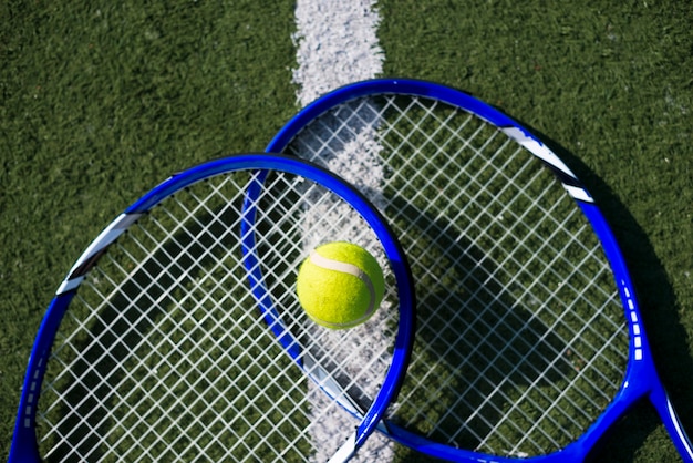 Top view tennis rackets with a ball