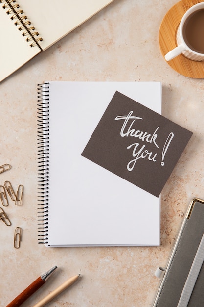 Free photo top view thank you note and notebook