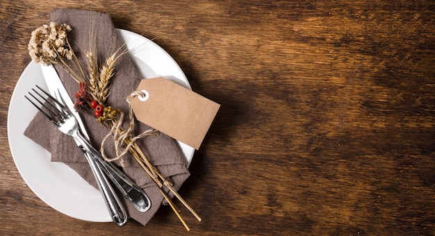 Top view of thanksgiving dinner table arrangement with copy space