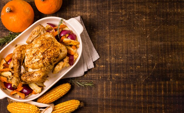 Top view of thanksgiving roasted chicken with corn