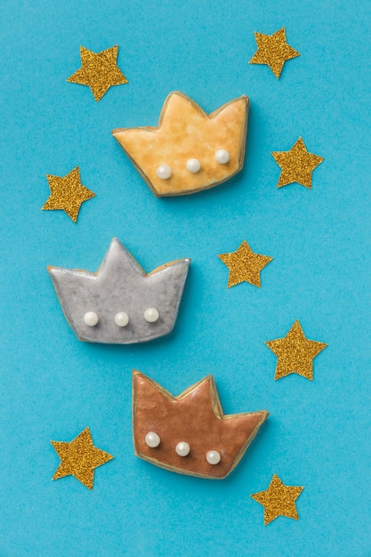 Top view of three crowns with stars for epiphany day