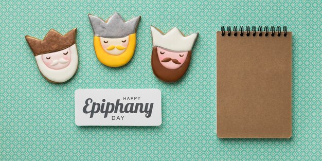 Top view of three kings with cardboard notebook for epiphany day