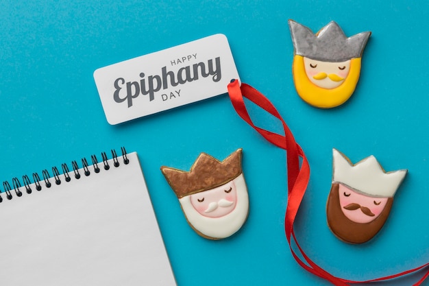 Top view of three kings with notebook and ribbon for epiphany day