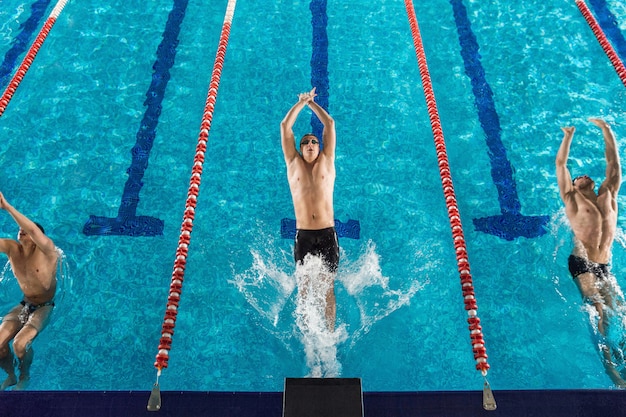 Top view of three male swimmers