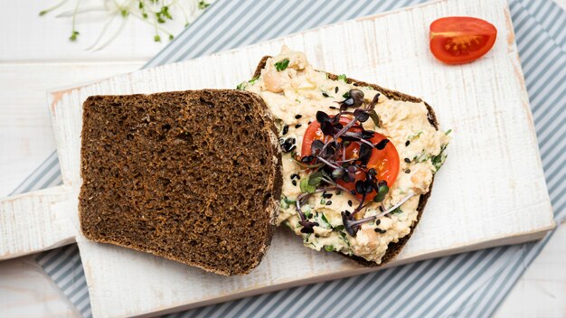 Top view toast bread with veggies pasta and tomatoes